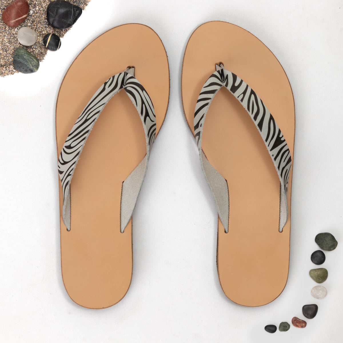 Artemis Natural Zebra leather toe-post sandals on foot